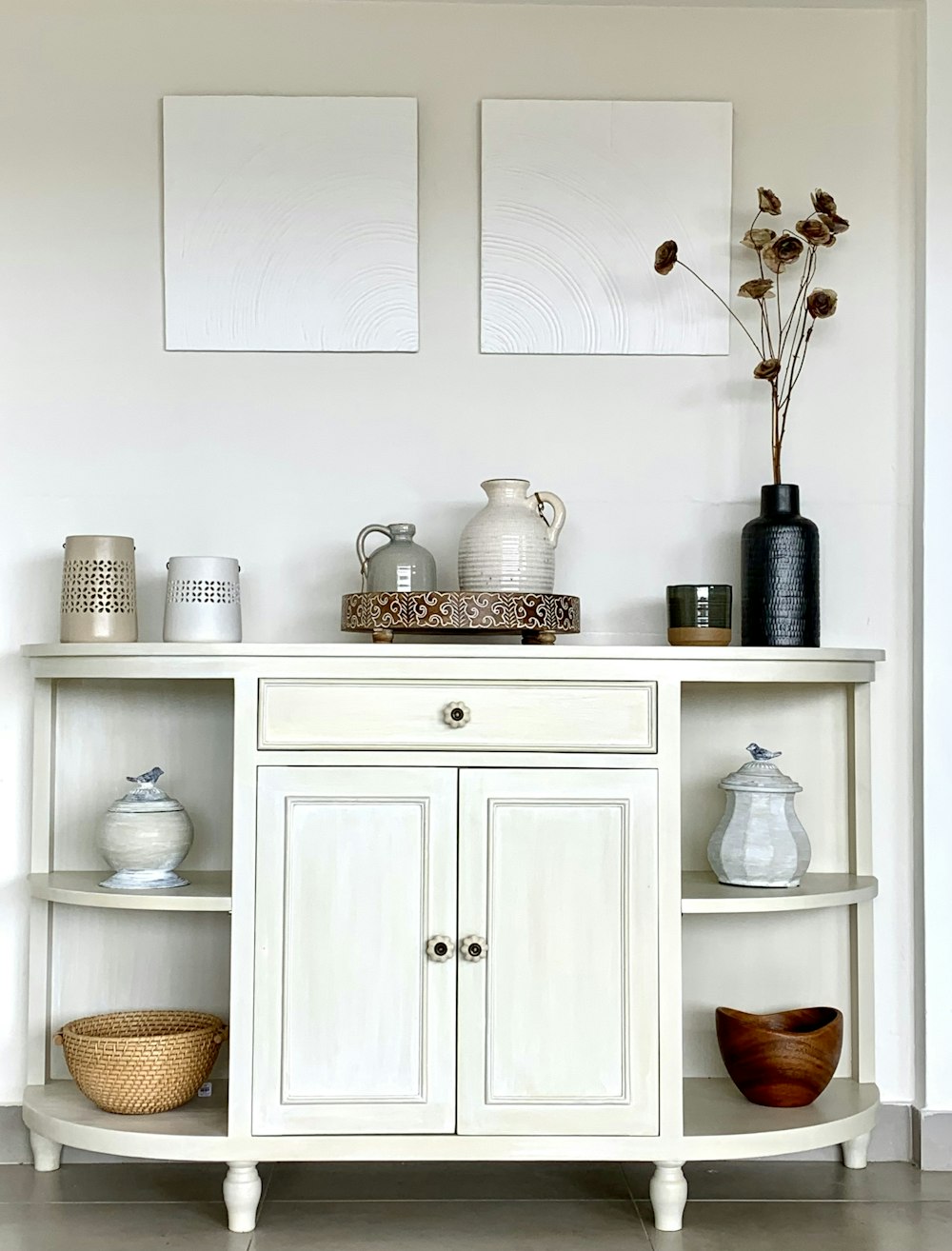 a white cabinet with a white shelf and white cabinets