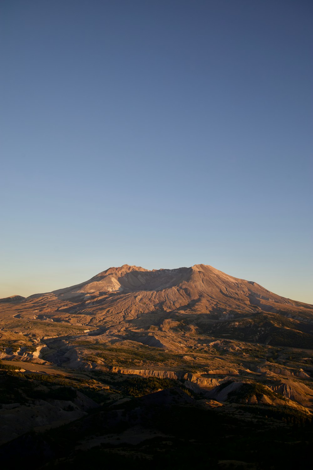 a mountain range with a blue sky