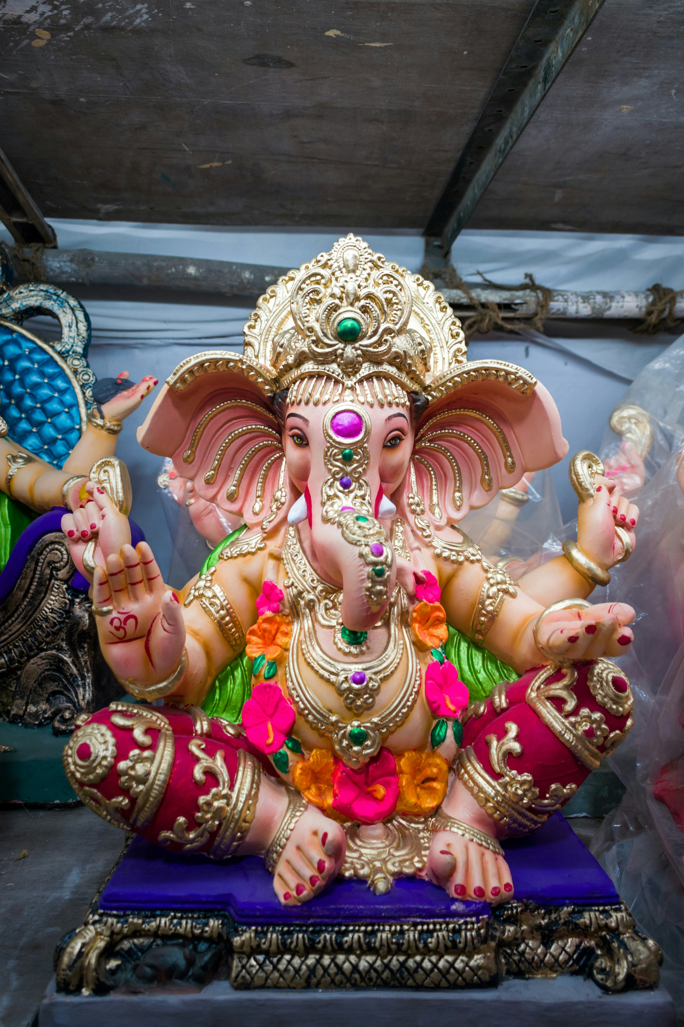 A statue of a person wearing a crown and holding a staff photo ...