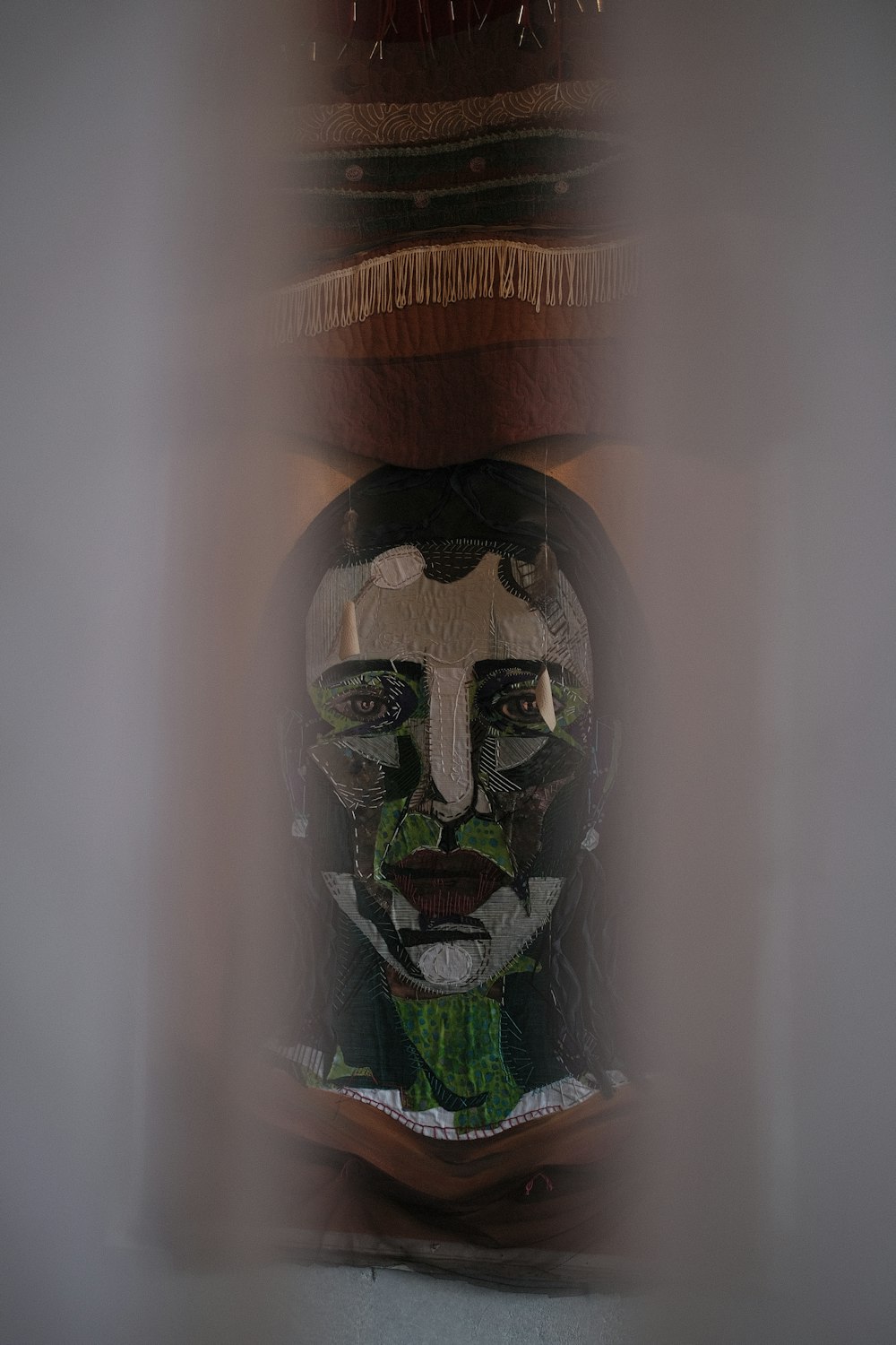 a glass lantern with a face