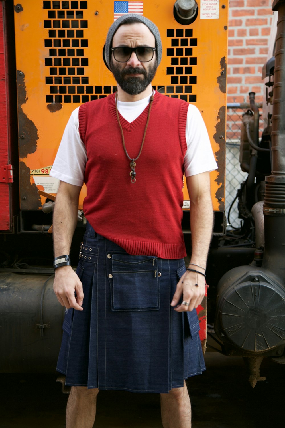 a man wearing sunglasses and a red shirt