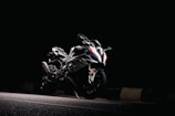 a motorcycle parked on the side of a road at night