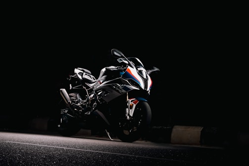 a motorcycle parked on the side of a road at night