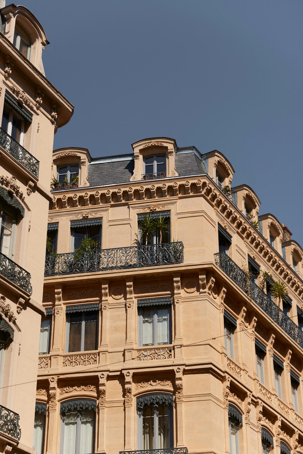 a building with balconies and a blue sky