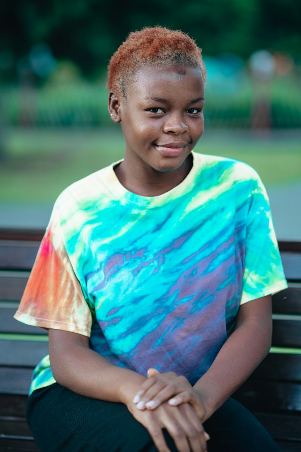 a boy sitting on a bench