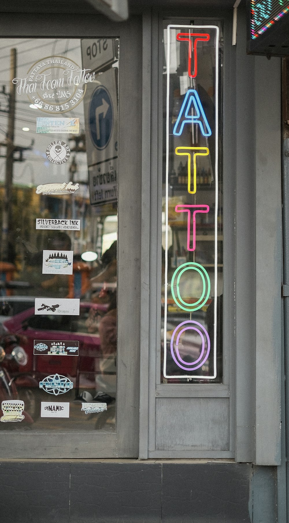 a store front with signs