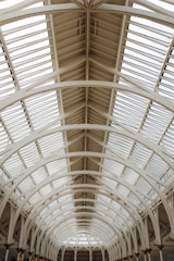 Interior view of a PEB structure with high ceilings and natural light streaming in.