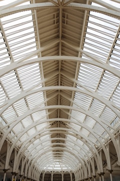 Interior view of a PEB structure with high ceilings and natural light streaming in.