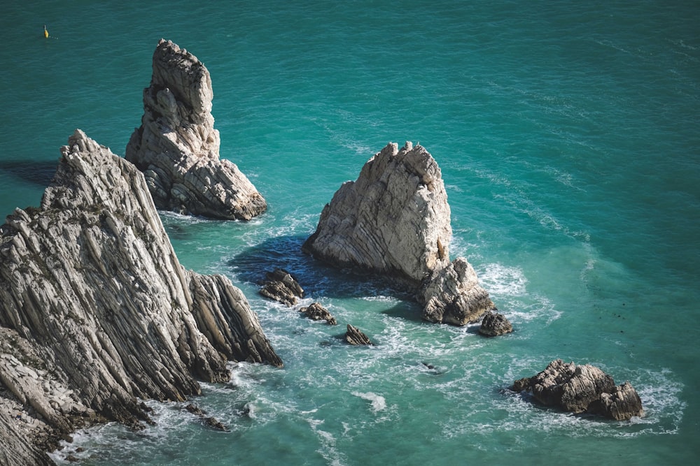 a group of rocks in the water