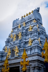 a building with gold statues