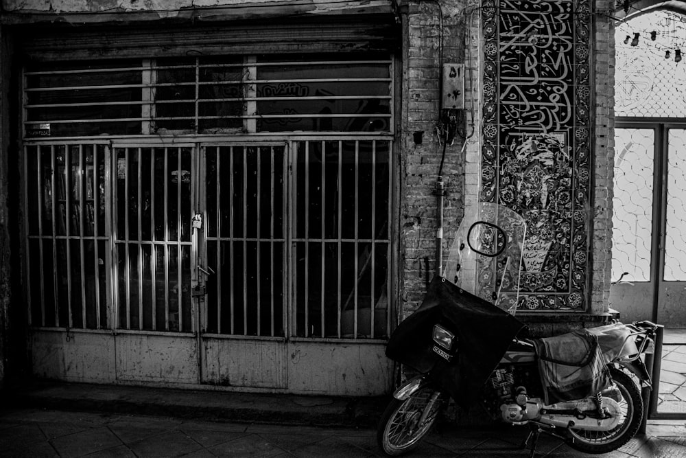 a motorcycle parked in front of a gate