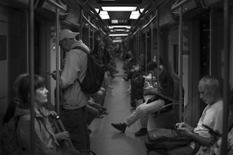 a group of people sitting at a train station