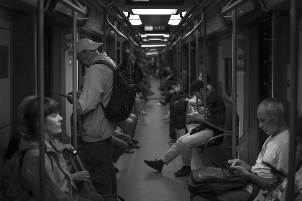 a group of people sitting at a train station