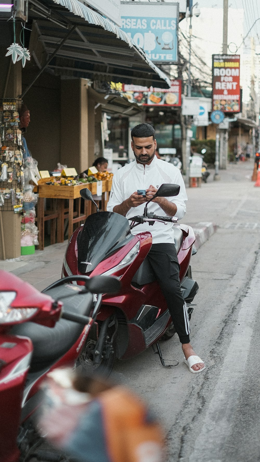 a person riding a motorcycle on a city street