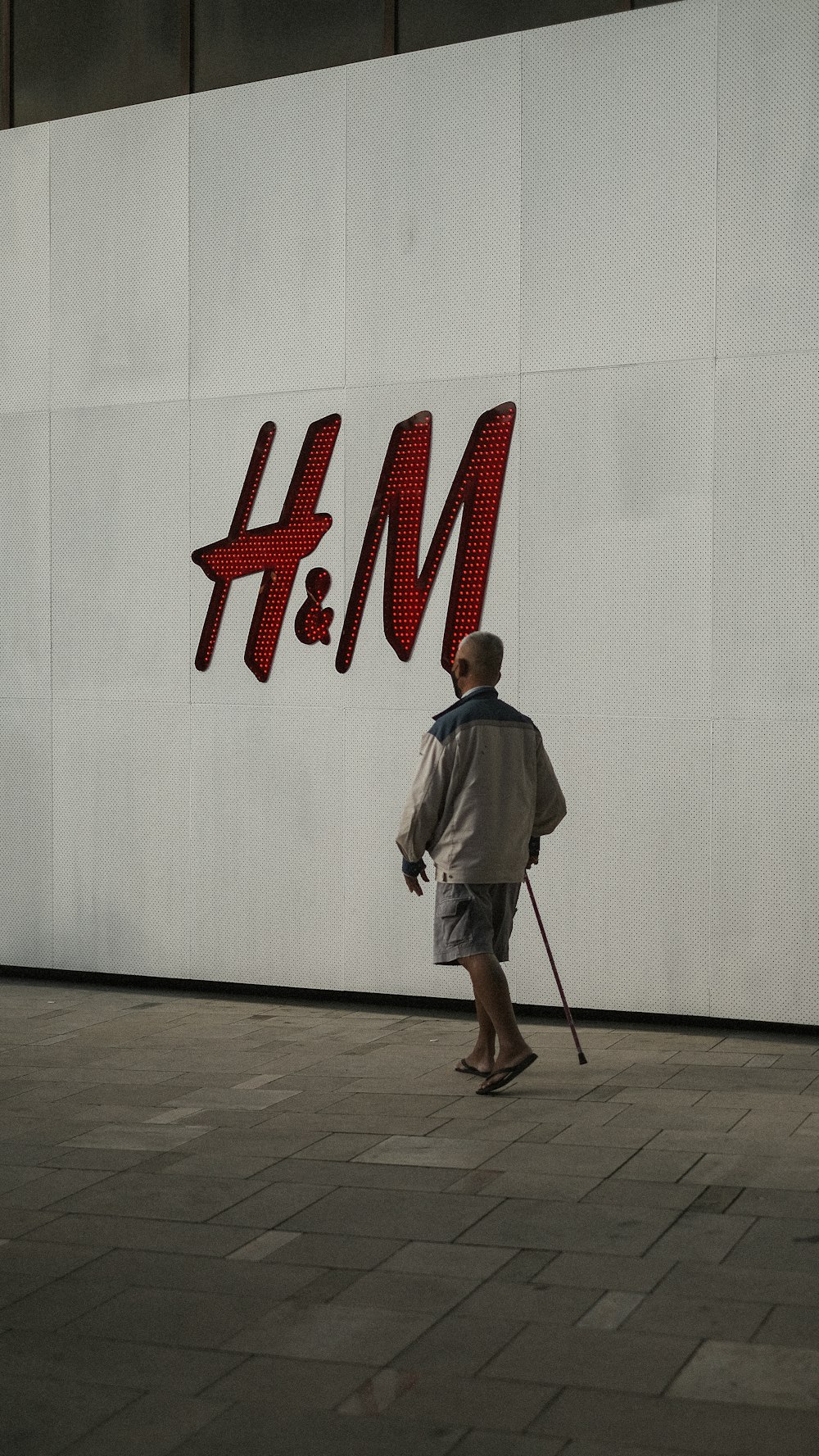 a man standing in front of a building