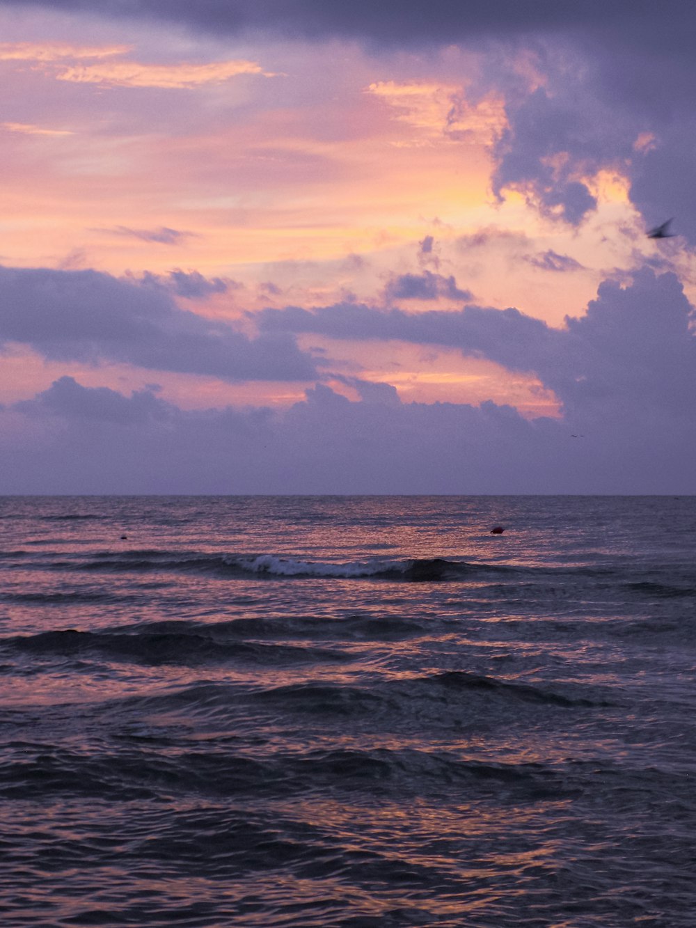 a body of water with a sunset