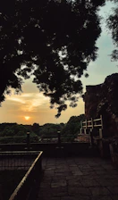 A peaceful view of the Santuario de Las Lajas at sunset with warm light.