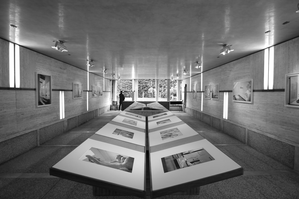 a large room with a large table and pictures on the wall