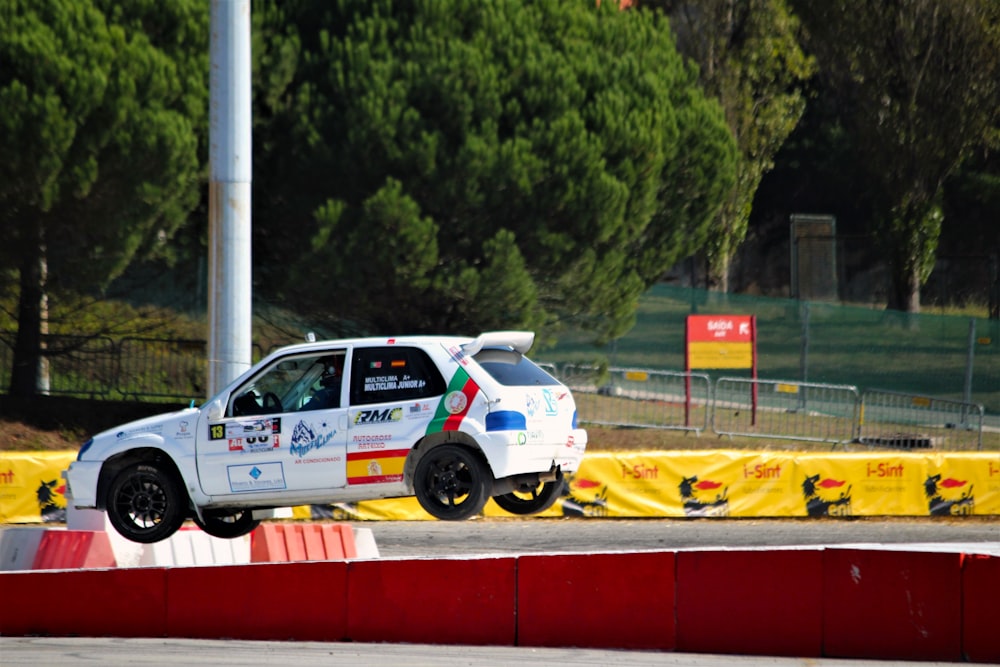 a white race car on a track