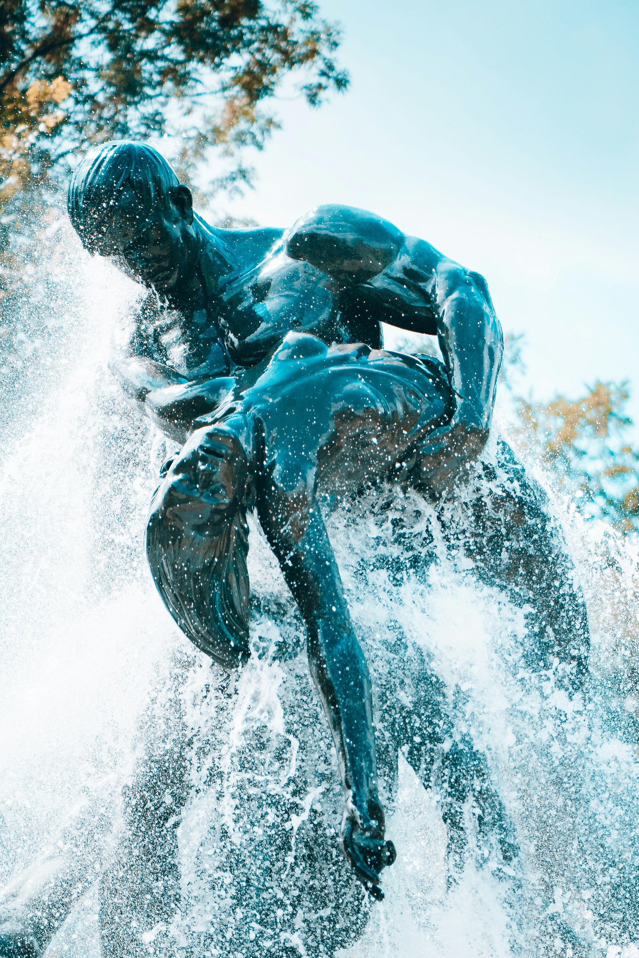 A man riding a dolphin photo – Free Building Image on Unsplash