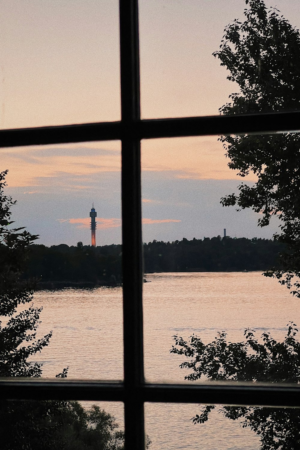 a view of a lake and a tower