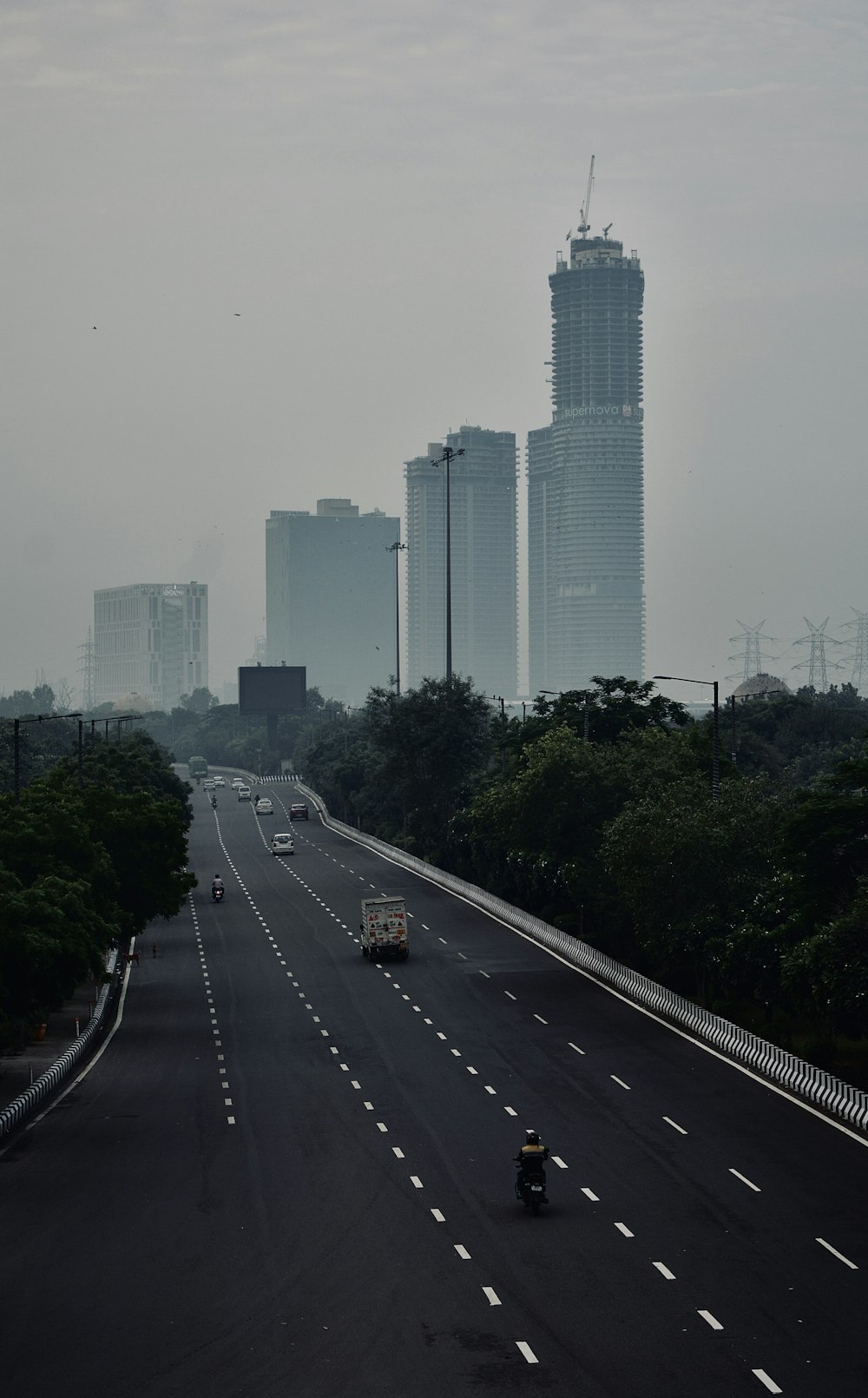 a road with cars and buildings on the side