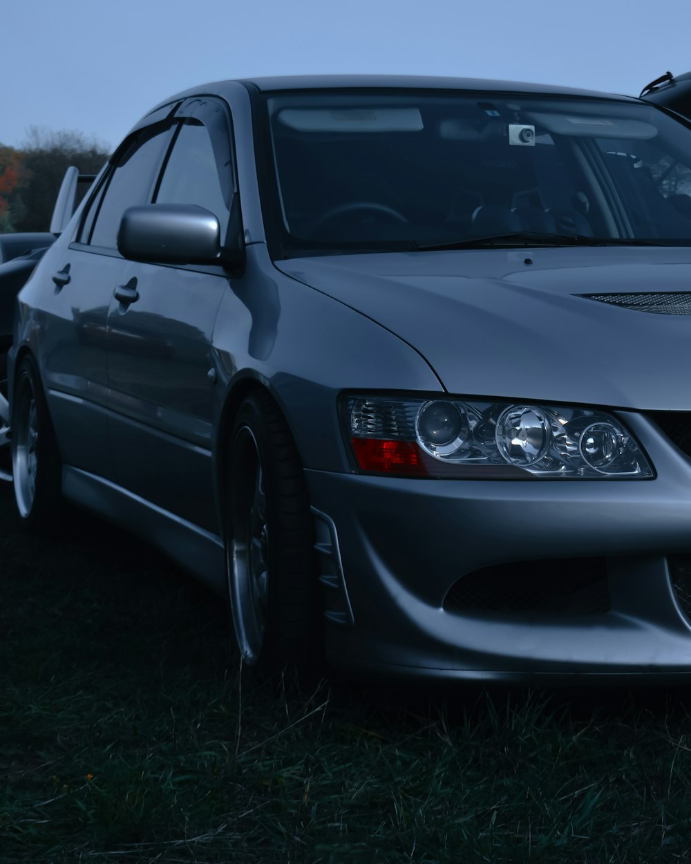 a car parked in a grassy area