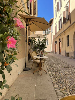 A warm, inviting street café in San Miguel de Allende with colonial architecture and vibrant terra cotta tones.