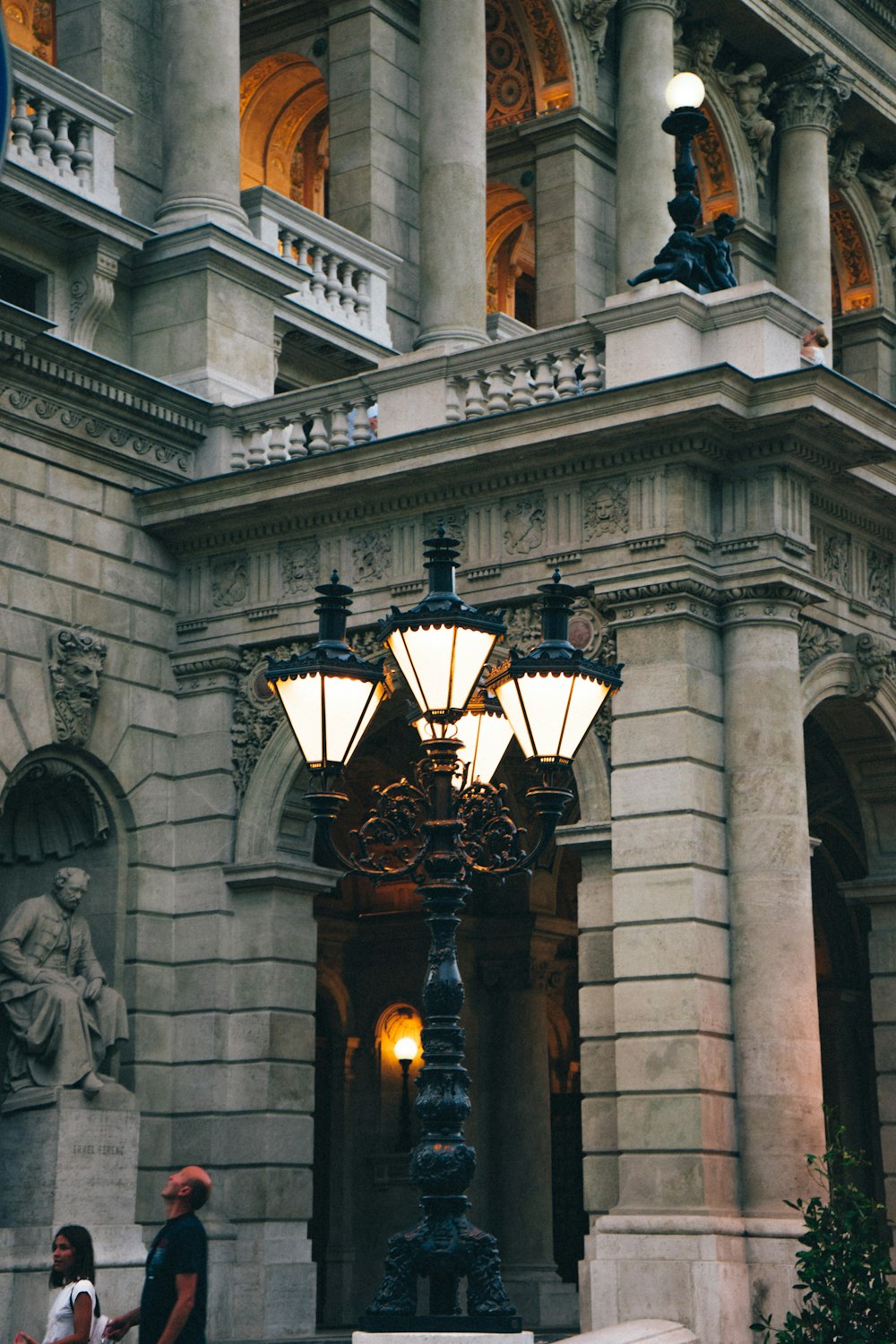 a lamp post in front of a building