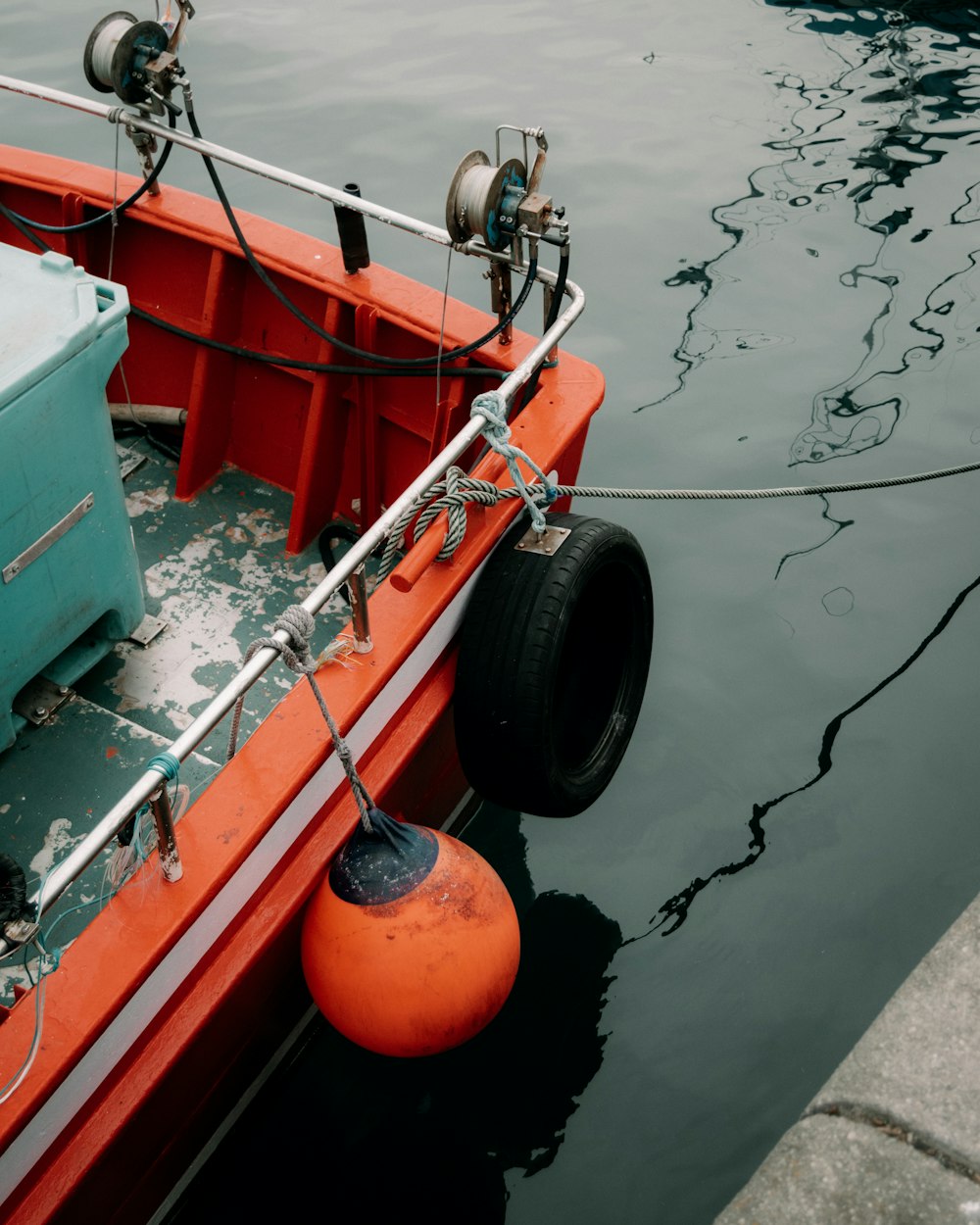 a boat with a tire on the front