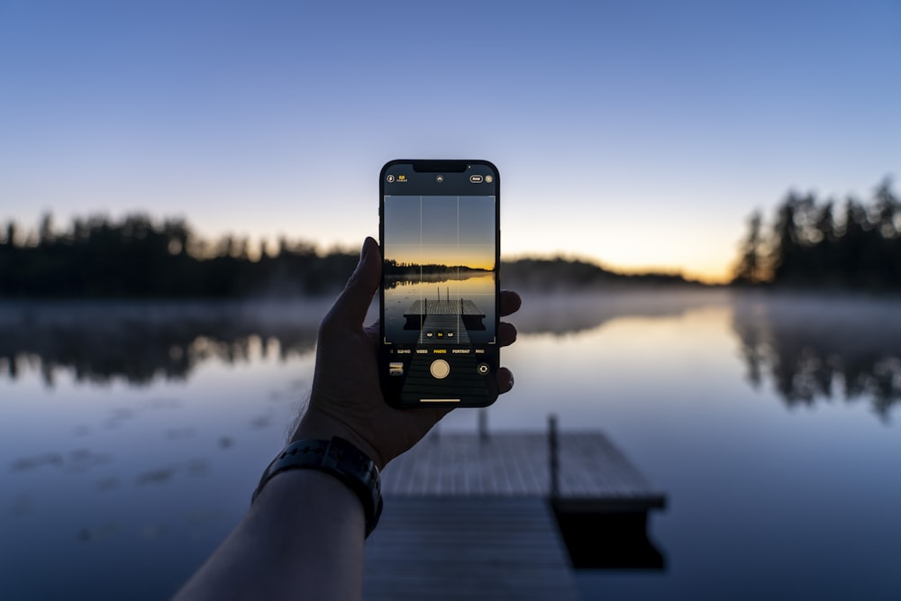 a hand holding a phone