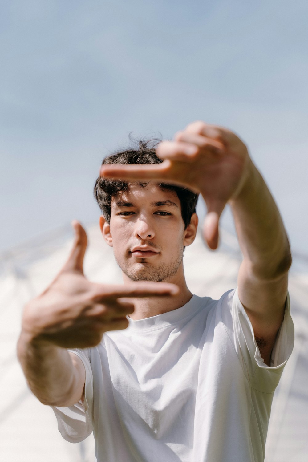 a man holding his hands up