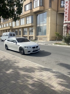 BMW luxury car parked on a Dakar street under the afternoon sun