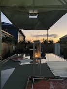 A peaceful patio area with garden lighting glowing at dusk