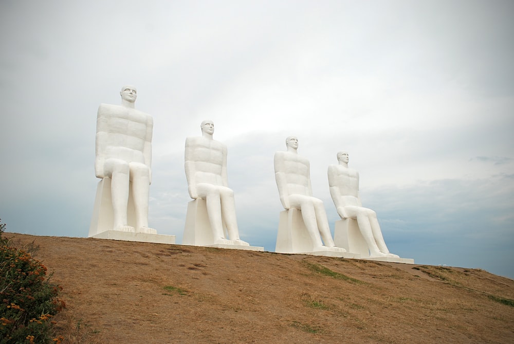 a group of statues on a hill
