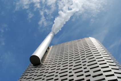 a tall building with a cylindrical top