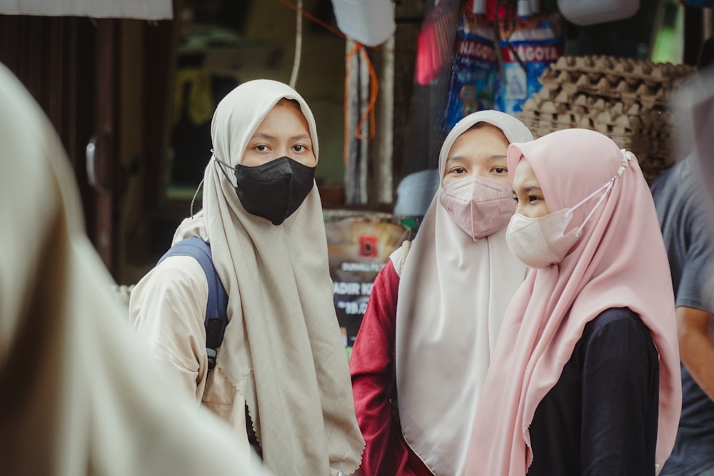 a group of people wearing masks