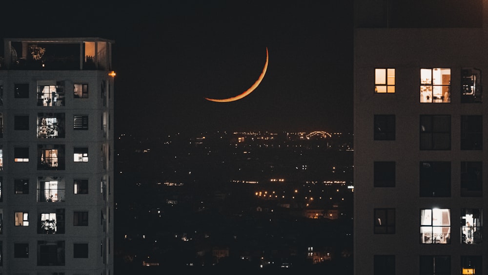 a crescent moon in the night sky