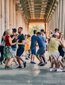 A group of students following a merengue instructor’s upbeat steps.