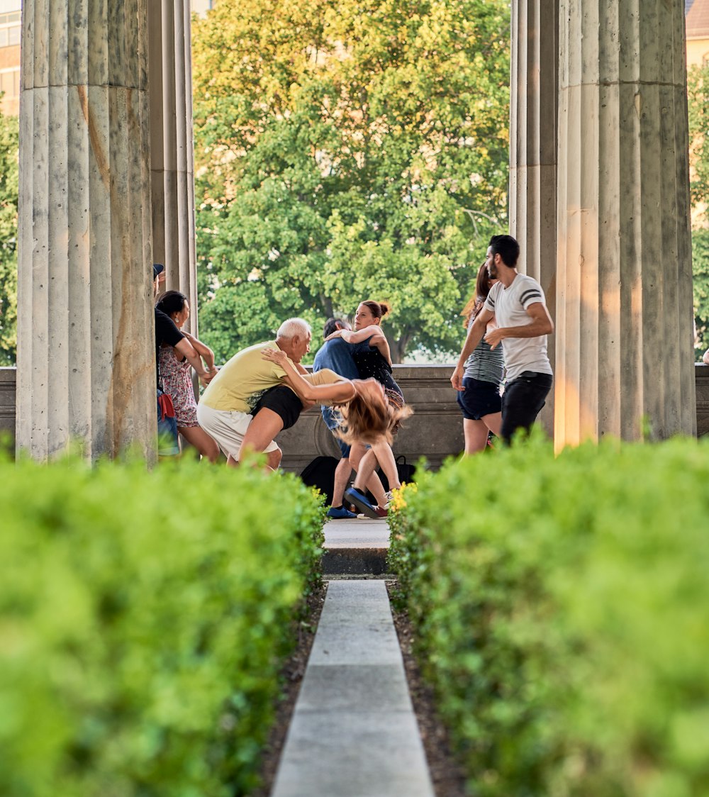 a group of people sitting on a bench