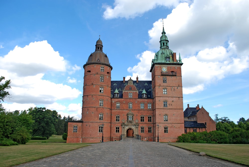 a large brick building with a clock tower