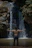 a man standing in front of a waterfall