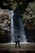 a man standing in front of a waterfall