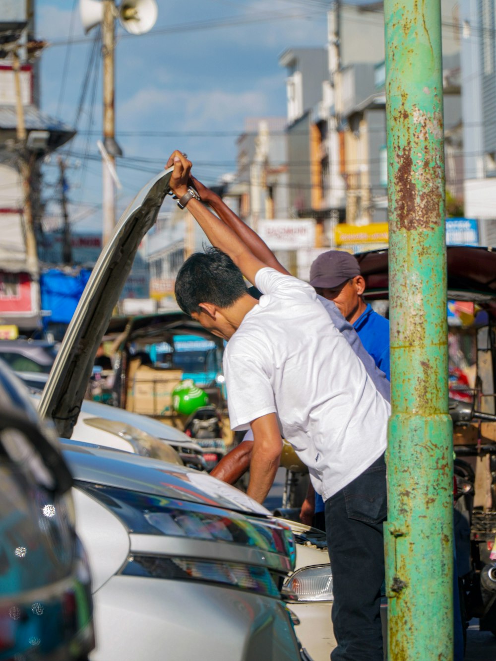 a man fixing a car