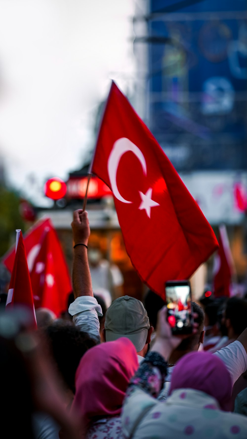 a group of people holding flags