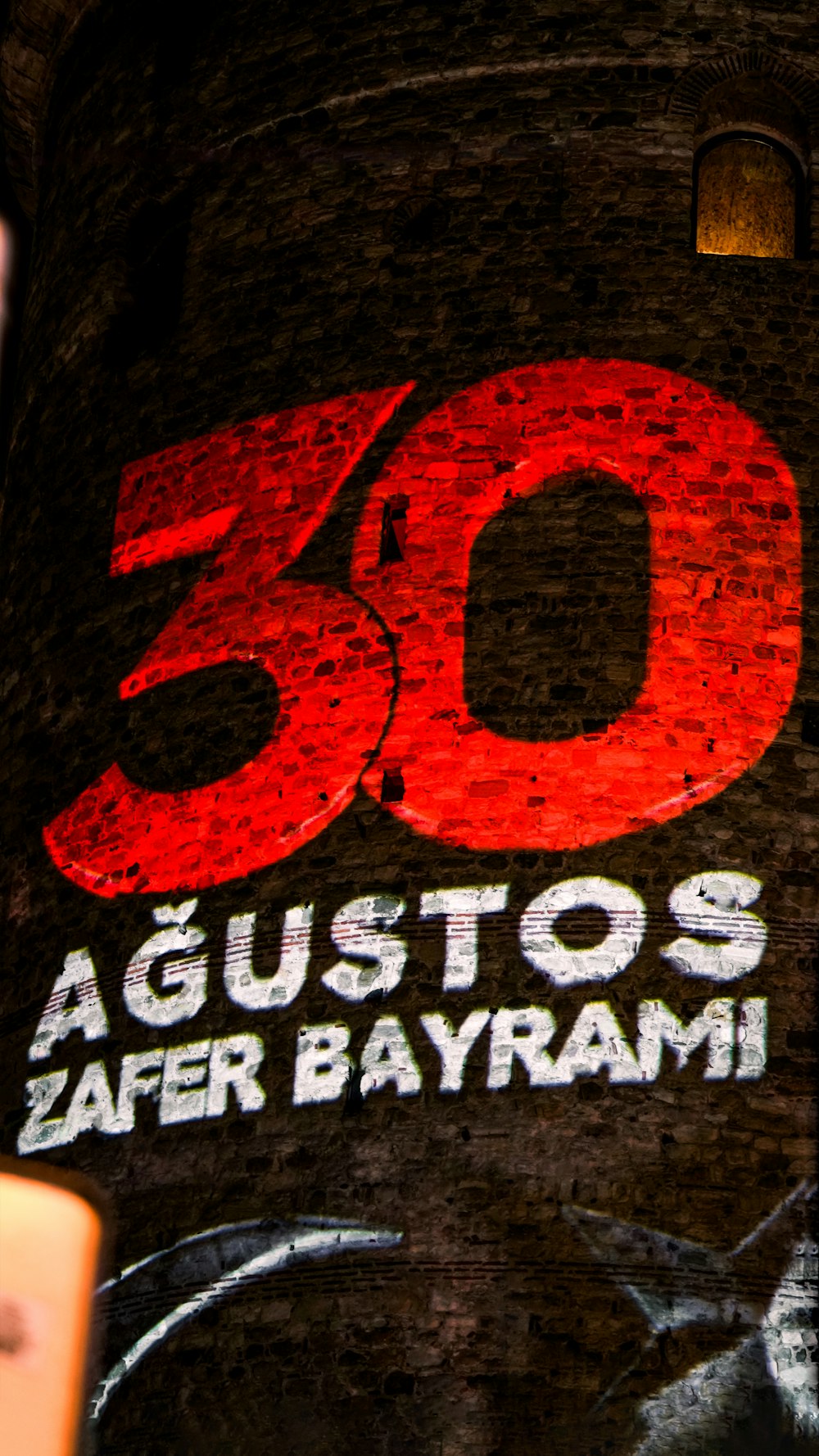 a black and red shirt with a skull and text