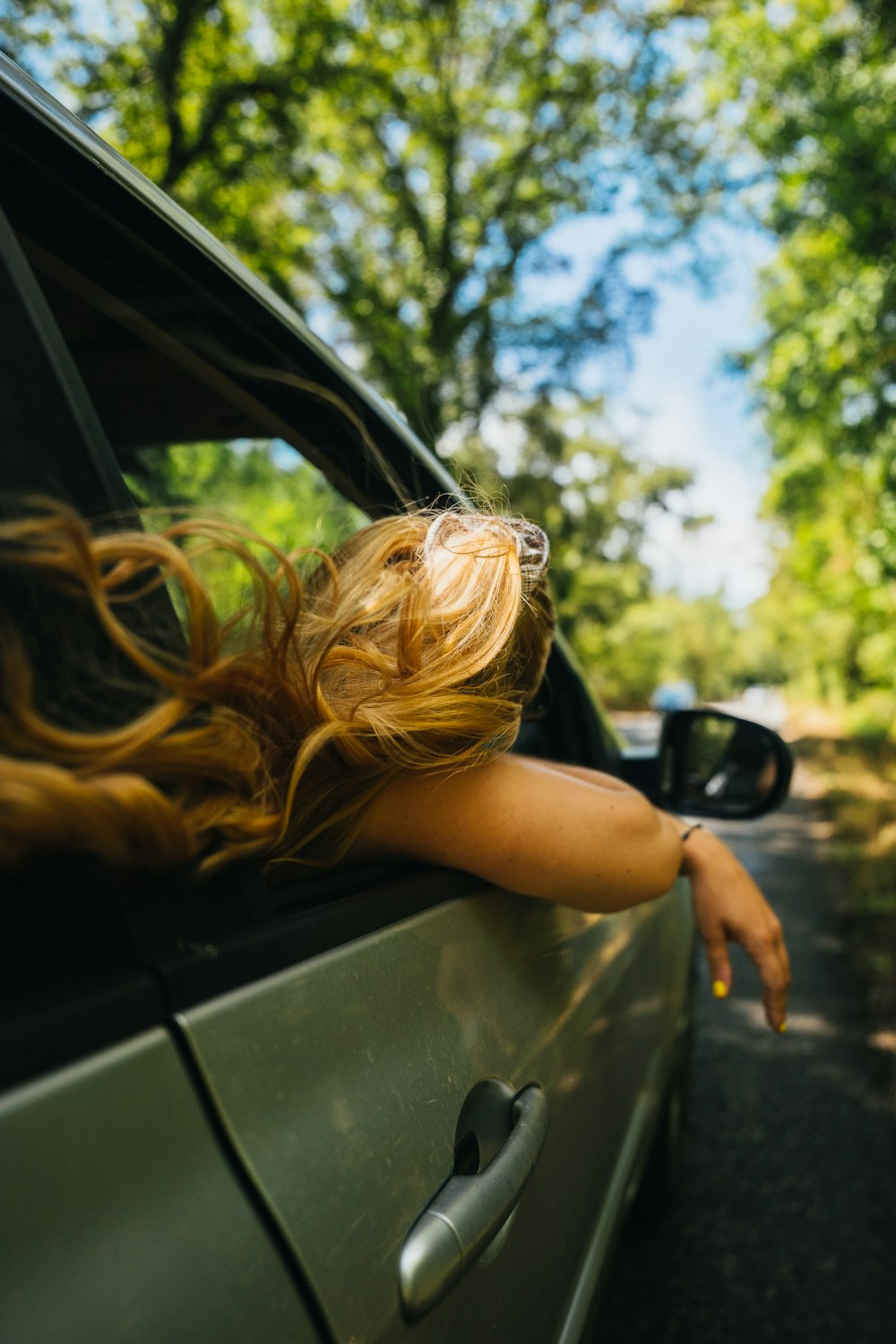 a woman sitting in a car