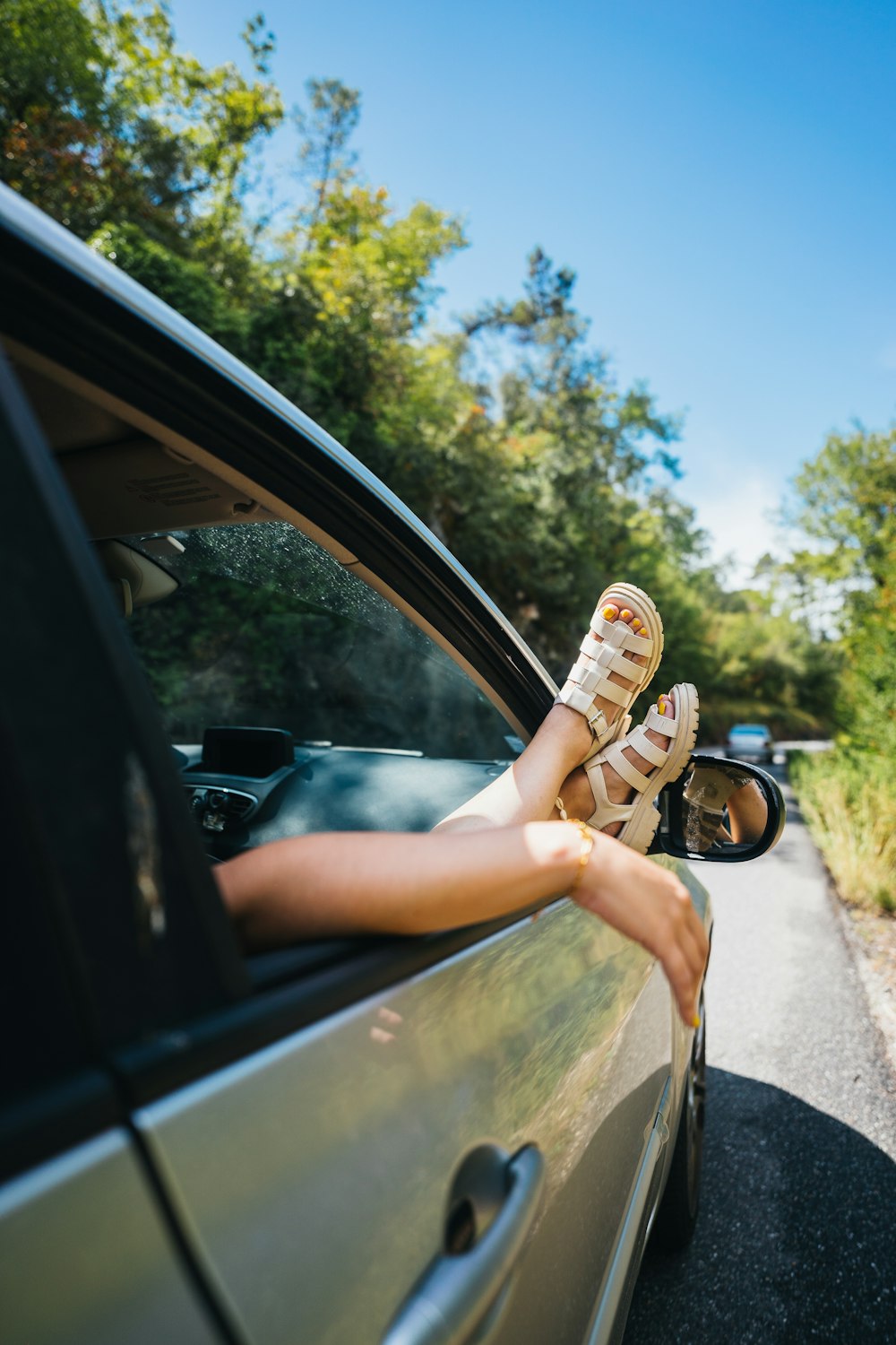 a person holding a can in a car