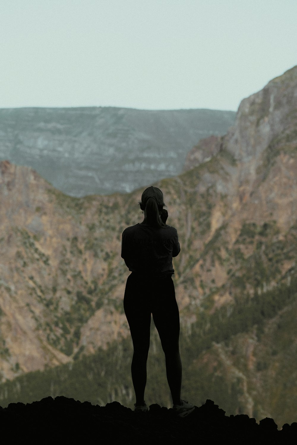 a person standing on a cliff