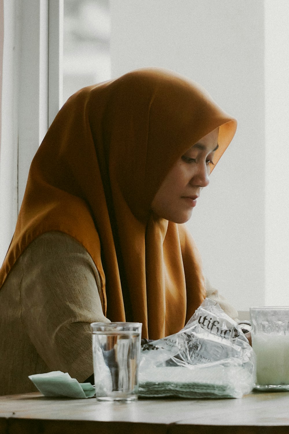 a woman sitting at a table